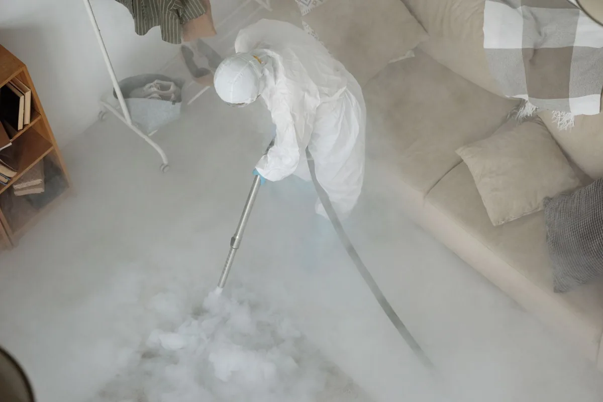 Biohazard cleanup technician in protective equipment, Richmond, TX